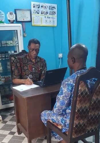 Herbal consultant discussing natural wellness with a client in Nigeria